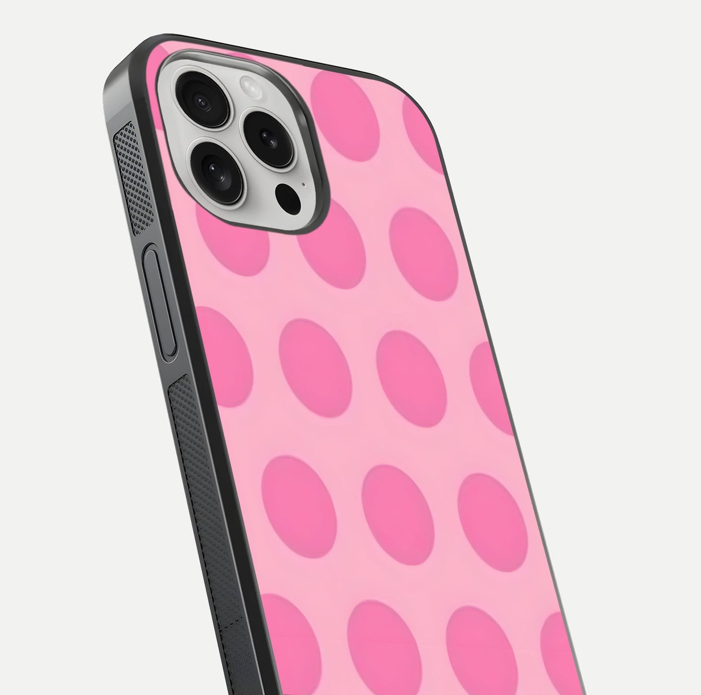 Sweet Dot Dreams iPhone 16 Pro glass phone case angled back view highlighting dotted artwork and side grip texture