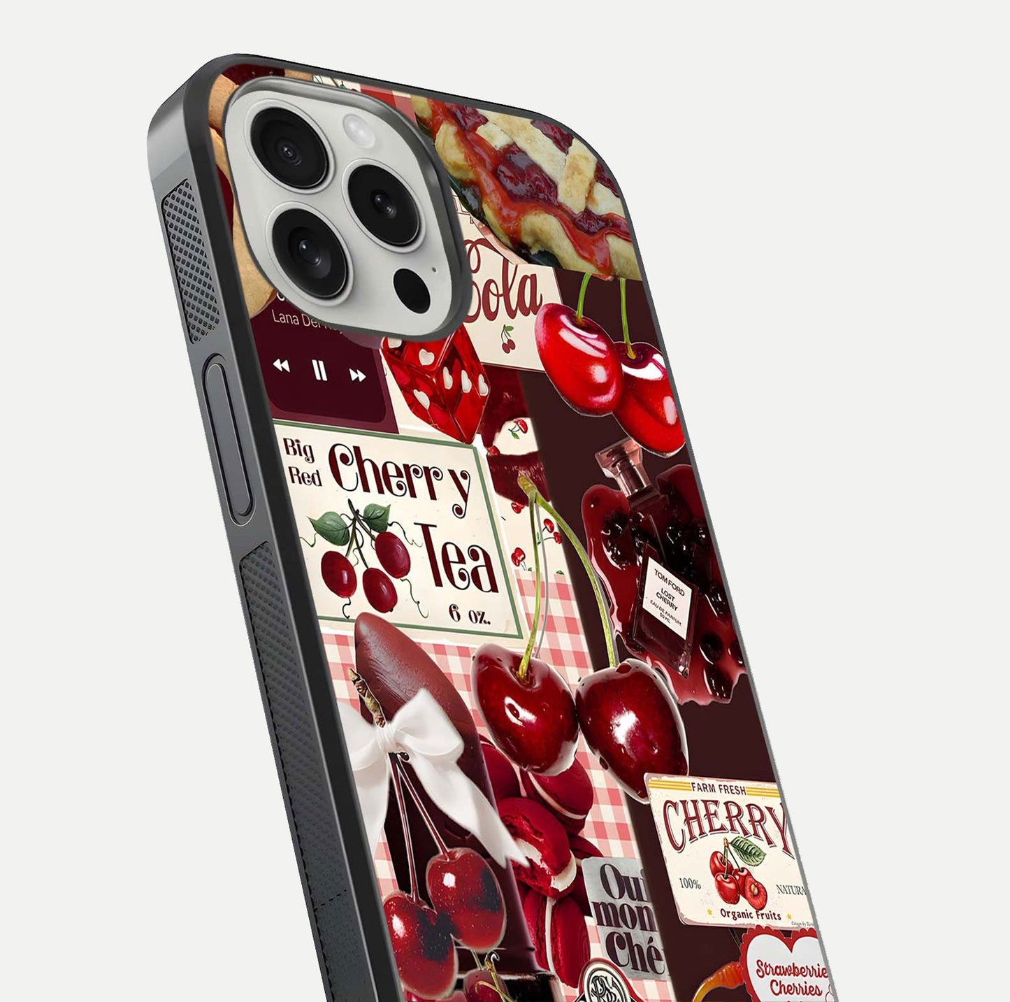 Aesthetic Cherry Tea Glass Case for iPhone 16 Pro close-up angled shot showing detailed cherry artwork, red tones, and gloss reflection