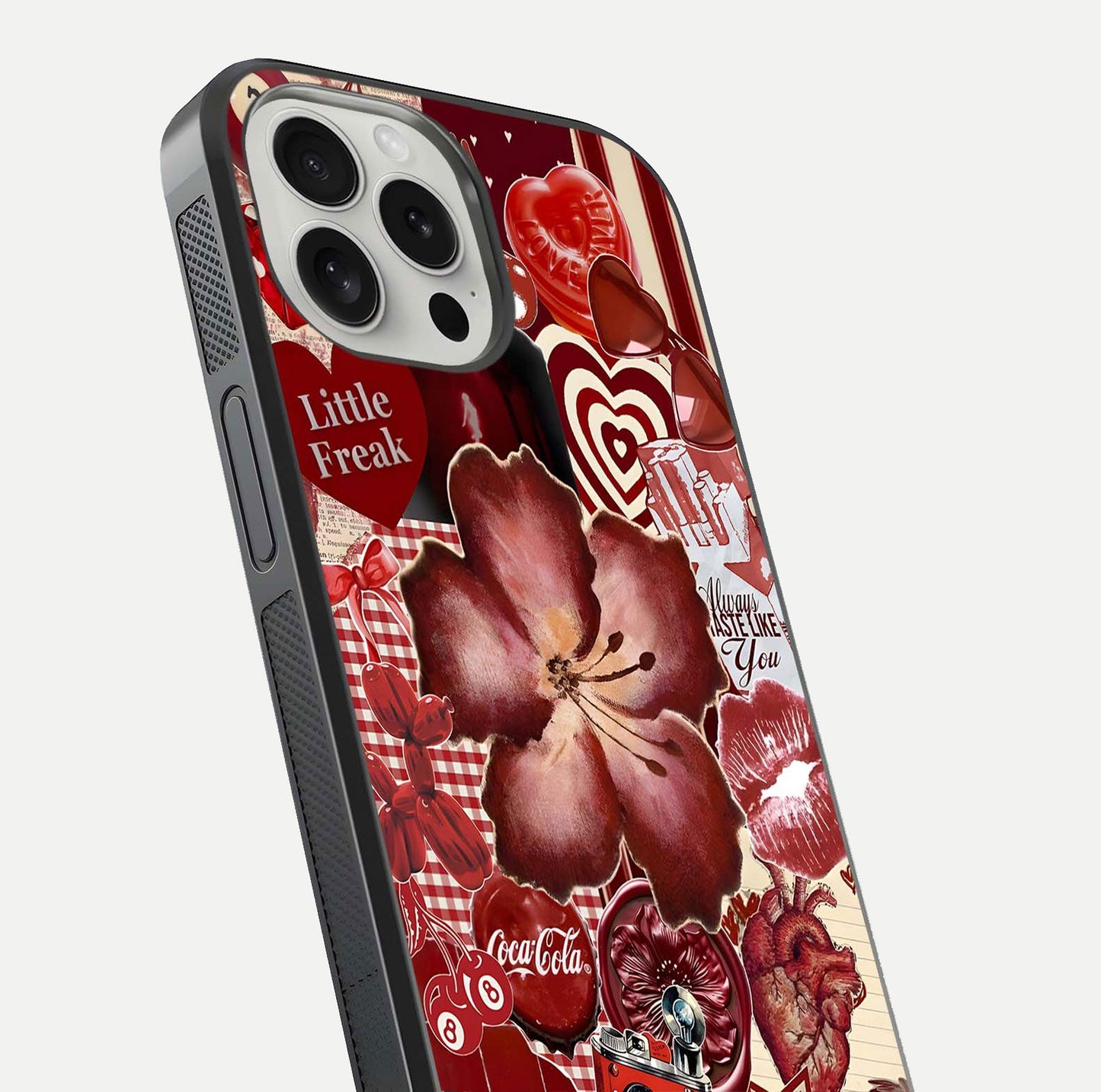 Aesthetic Little Freak Glass Case for iPhone 16 Pro close-up angled shot showing detailed artwork, bold design, and gloss reflection