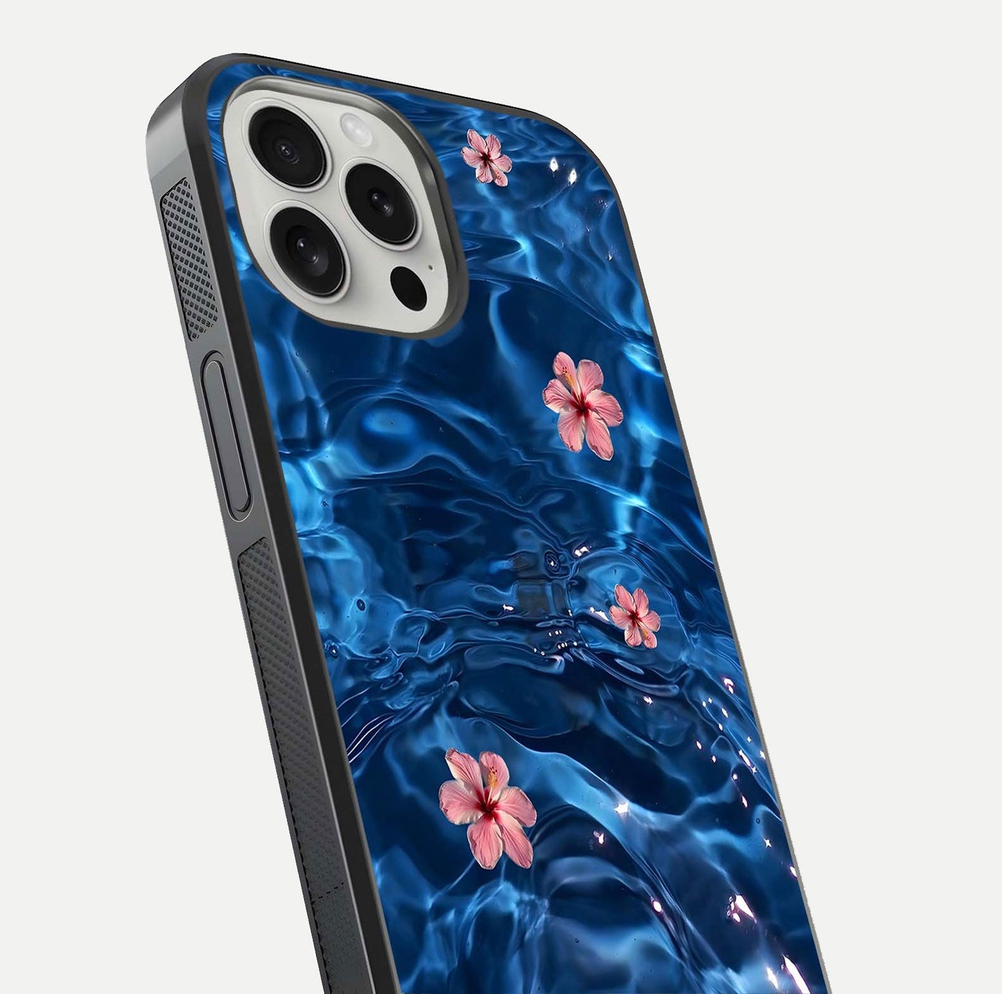 Blooming Water Drift Glass Case for iPhone 16 Pro close-up angle showing petal details, soft aqua tones, and smooth gloss reflection