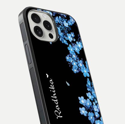 Blue Petal Dream Custom Name Glass Case for iPhone 16 Pro close-up highlighting petal texture and gloss reflection
