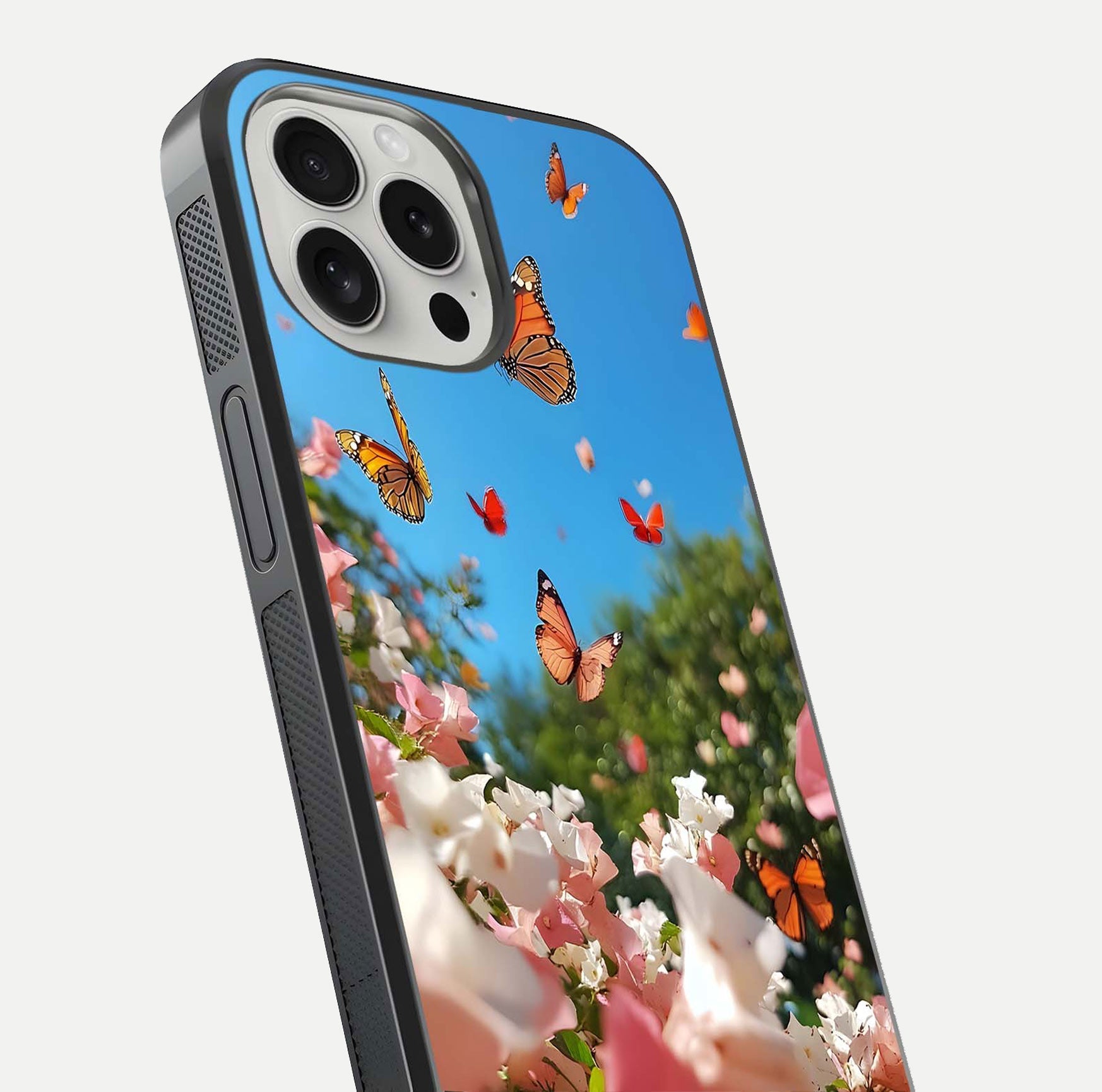 Butterflies in Bloom Sky Glass Case for iPhone 16 Pro close-up shot showing wings, petal reflections, and soft hues