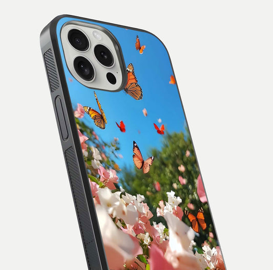 Butterflies in Bloom Sky Glass Case for iPhone 16 Pro close-up shot showing wings, petal reflections, and soft hues
