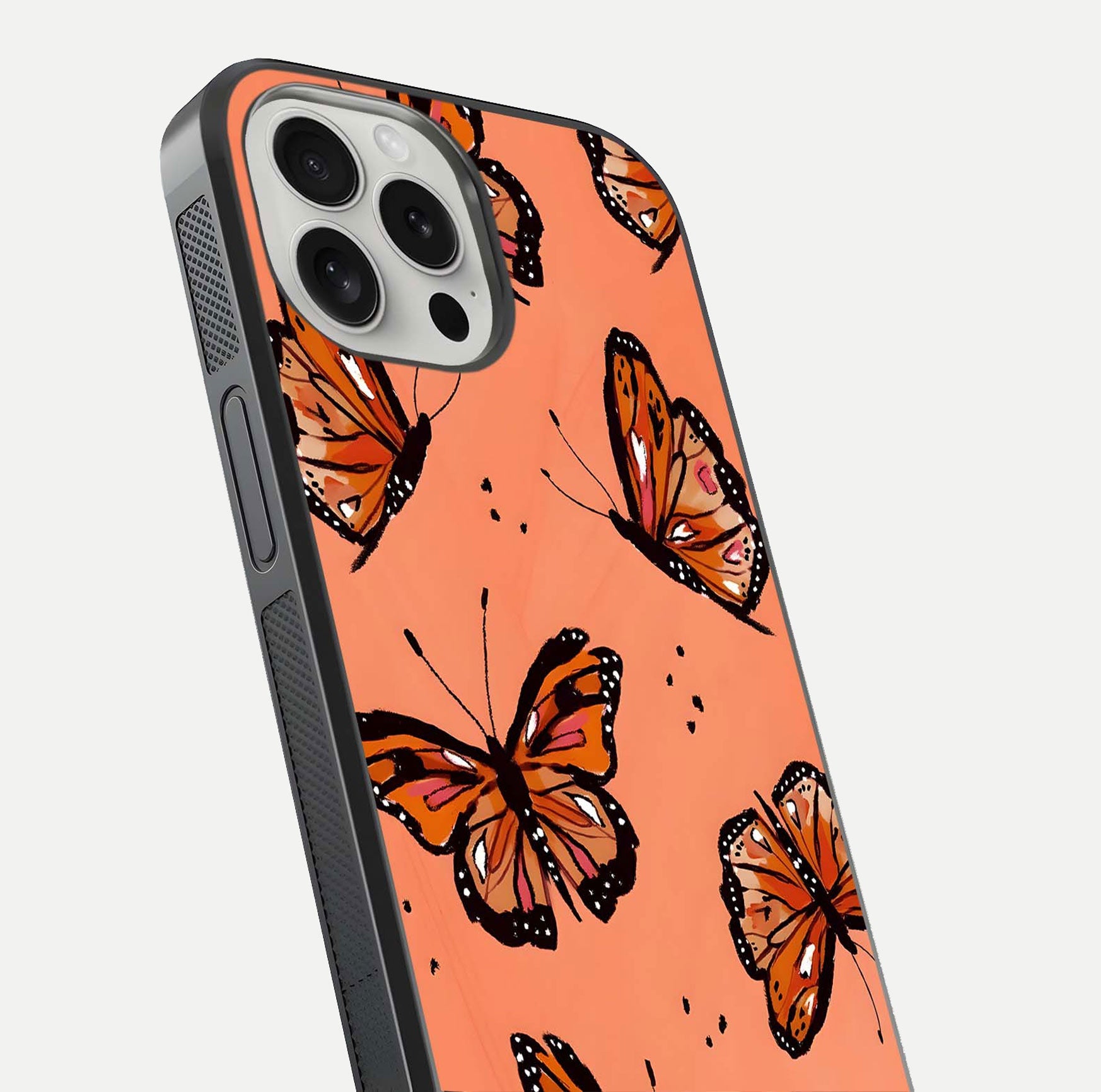 Coral Wing Butterfly Glass Case for iPhone 16 Pro close-up highlighting wing pattern, coral tones, and reflection shine