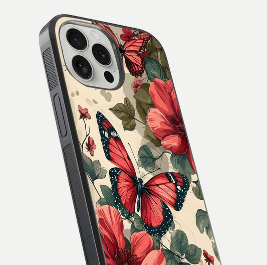 Crimson Butterfly Garden Glass Case for iPhone 16 Pro close-up showing wing detail and reflection shine