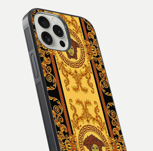 Golden Royal Heritage Glass Case for iPhone 16 Pro close-up angled shot showing intricate design and metallic reflection