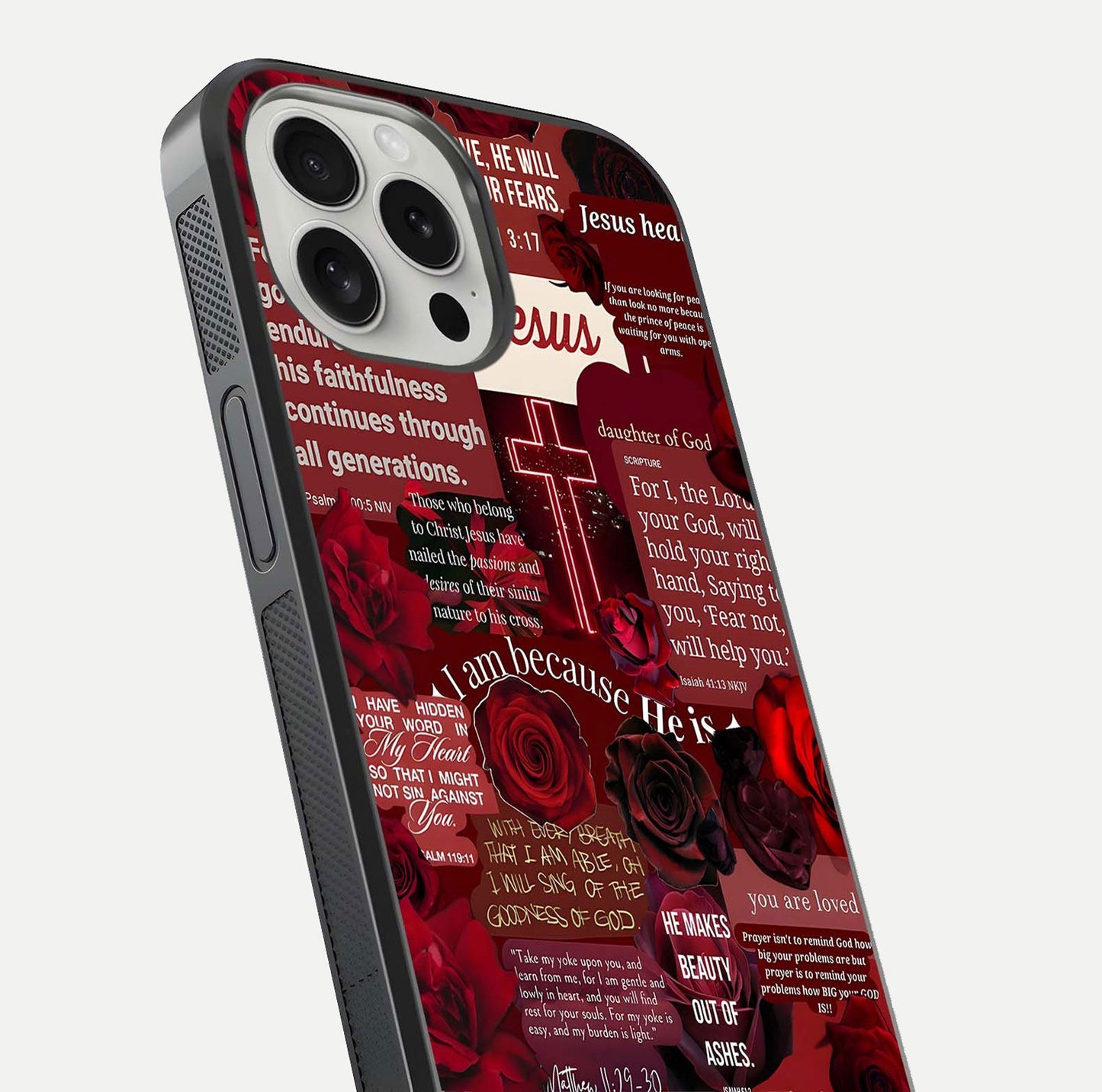 Jesus Love Heals Glass Case for iPhone 16 Pro close-up angled shot showing healing text, cross detailing, and reflection