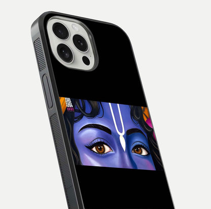 Krishna Eye Glass Case for iPhone 16 Pro close-up angled shot showing intricate artwork and reflection shine