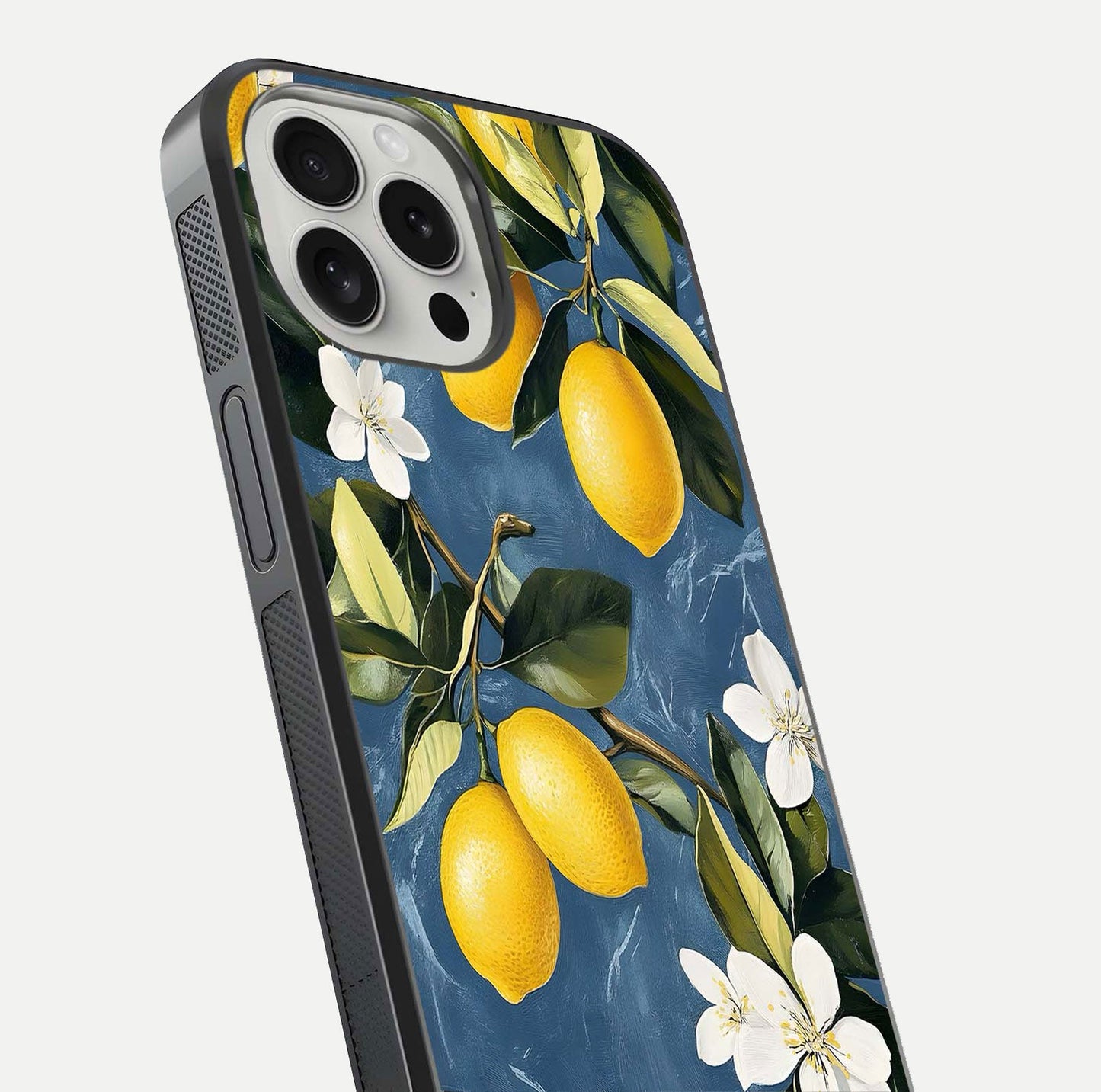 Lemon Dream Garden Glass Case for iPhone 16 Pro close-up angled shot showing fruit details and shine reflection