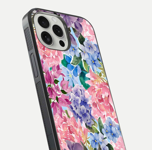 Pastel Floral Mix Glass Case for iPhone 16 Pro close-up angled shot highlighting flower detail and reflection