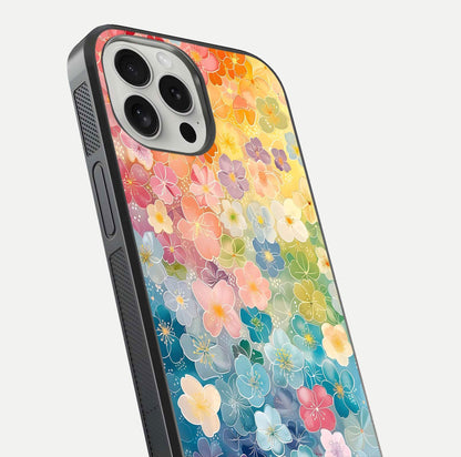 Rainbow Blossom Burst Glass Case for iPhone 16 Pro close-up angled shot showing petal colors and reflection