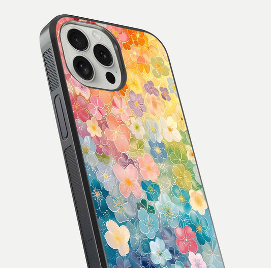 Rainbow Blossom Burst Glass Case for iPhone 16 Pro close-up angled shot showing petal colors and reflection