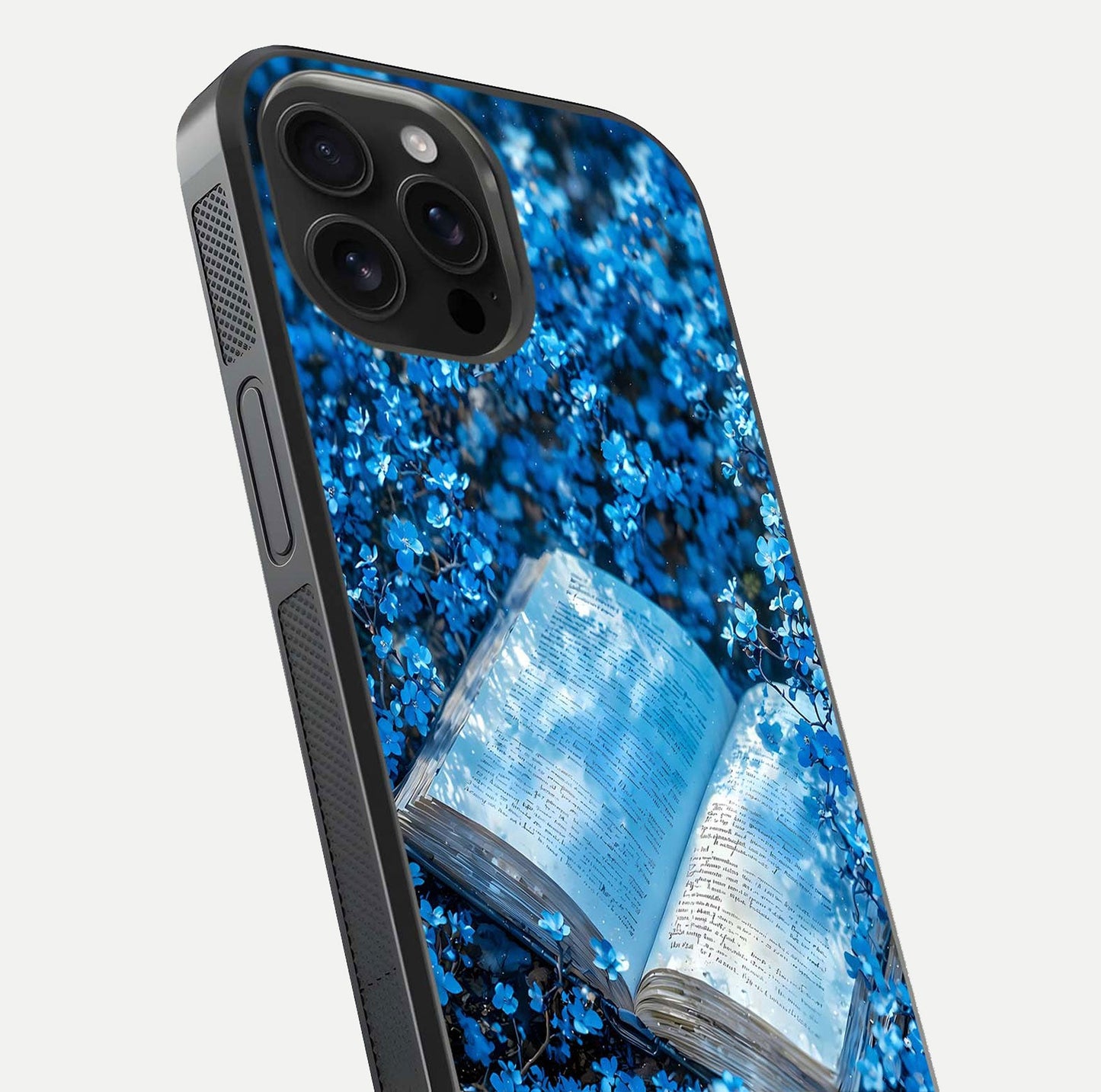 Blue Bloom Tales Glass Case for iPhone 16 Pro Max close-up angle showing petal texture and blue tone reflection