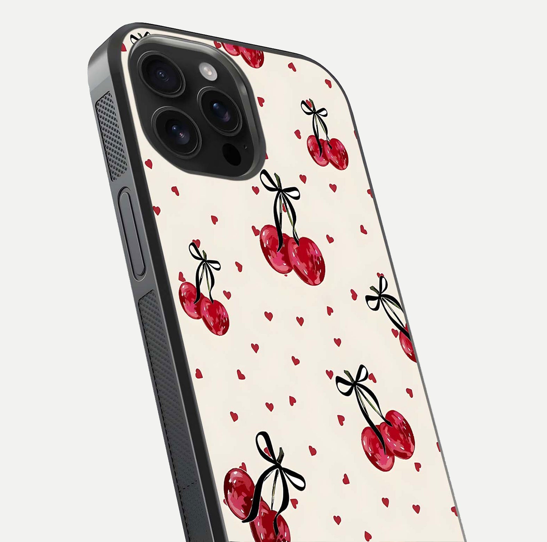 Cherry Heart Bow Glass Case for iPhone 16 Pro Max close-up highlighting small bows, cherry red tones, and gloss shine
