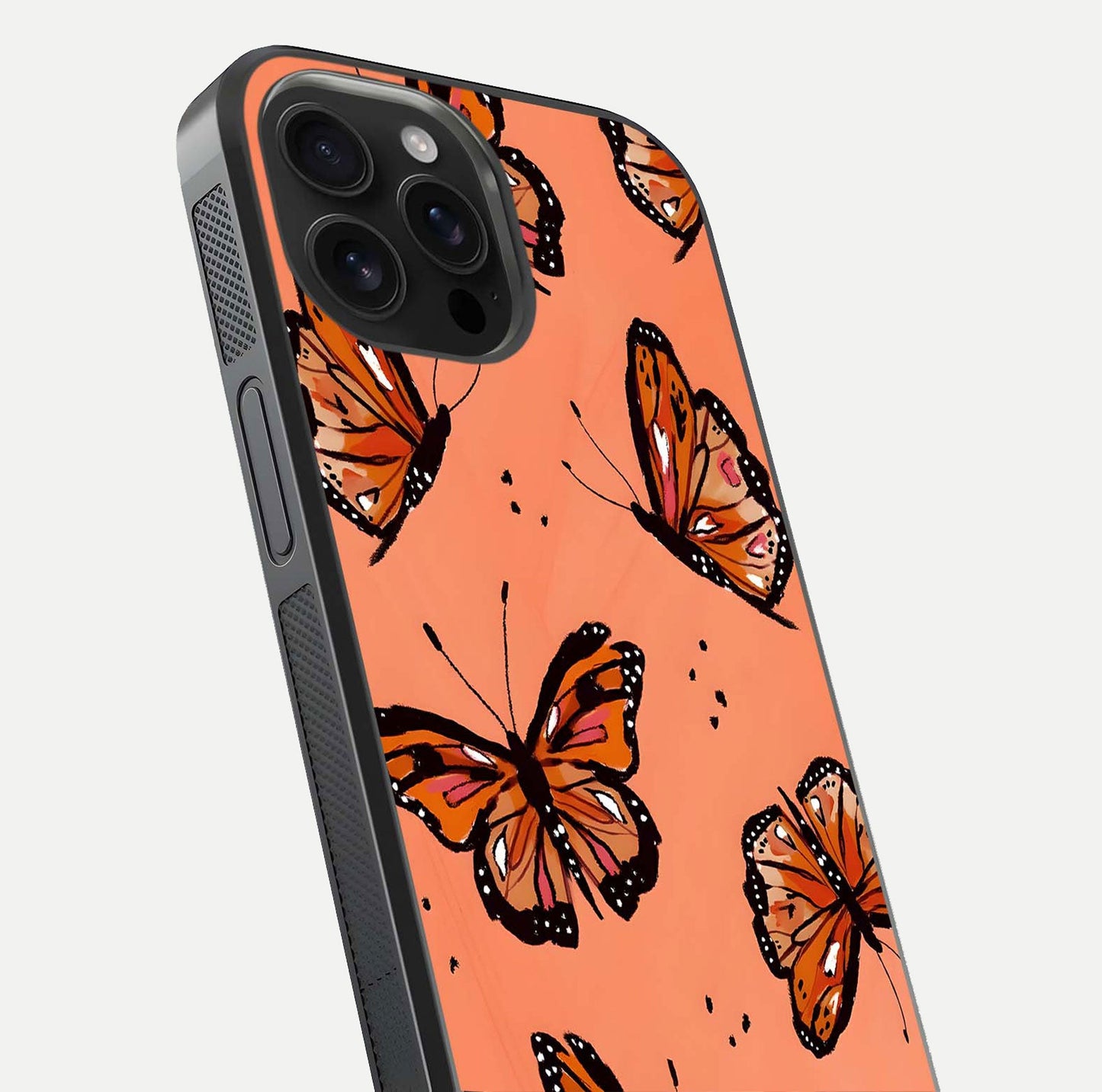 Coral Wing Butterfly Glass Case for iPhone 16 Pro Max close-up highlighting wing pattern, coral tones, and reflection shine
