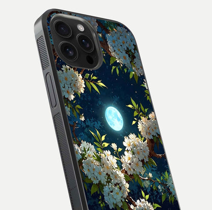 Moonlit Blossom Dream Glass Case for iPhone 16 Pro Max close-up angled shot showing glowing petals and reflection