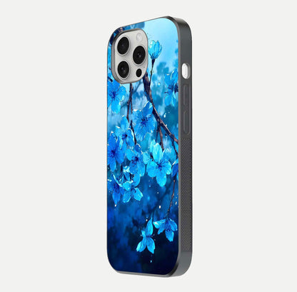 Blue Blossoms Branch Glass Case for iPhone 16 Pro side-angle image showing blossom pattern flow and glossy texture