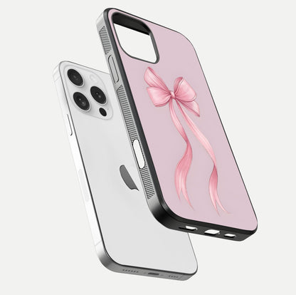 Soft Blush Bow iPhone 16 Pro glass phone case floating view emphasizing glossy surface and soft feminine styling