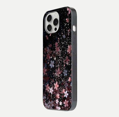 Starlit Flower Dreams Glass Case for iPhone 16 Pro side-angle image showing shine, edge detail, and floral contrast