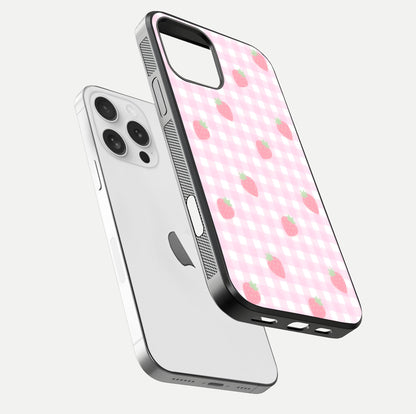 Strawberry Picnic Love iPhone 16 Pro glass phone case floating view emphasizing glossy finish and playful charm
