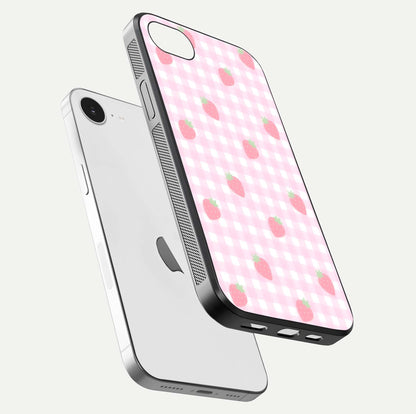 Strawberry Picnic Love iPhone 16e glass phone case floating view emphasizing glossy finish and playful charm