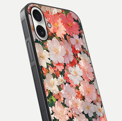 Blush Bloom Field Glass Case for iPhone 17 close-up shot capturing pastel flower field tones and gloss shine
