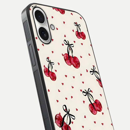 Cherry Heart Bow Glass Case for iPhone 17 close-up highlighting small bows, cherry red tones, and gloss shine