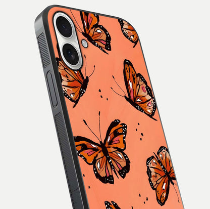 Coral Wing Butterfly Glass Case for iPhone 17 close-up highlighting wing pattern, coral tones, and reflection shine
