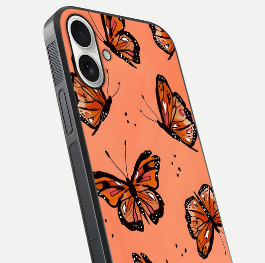 Coral Wing Butterfly Glass Case for iPhone 17 close-up highlighting wing pattern, coral tones, and reflection shine