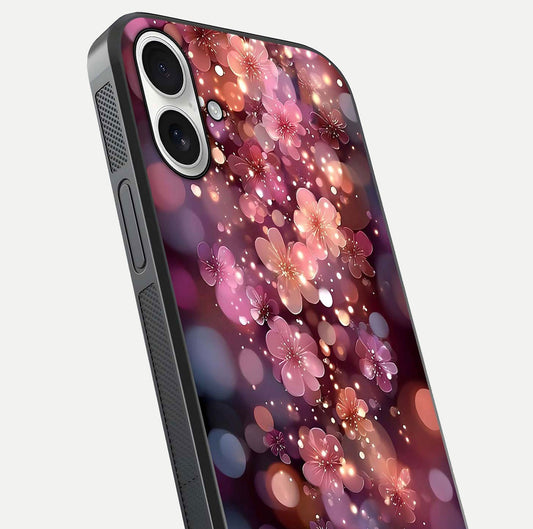 Glowing Petal Bliss Glass Case for iPhone 17 close-up angled shot showing petal glow, color depth, and reflection shine