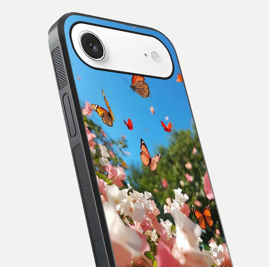 Butterflies in Bloom Sky Glass Case for iPhone Air  close-up shot showing wings, petal reflections, and soft hues