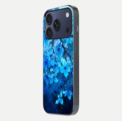 Blue Blossoms Branch Glass Case for iPhone 16 Pro side-angle image showing blossom pattern flow and glossy texture