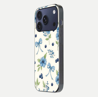 Blue Flower & Bow Glass Case for iPhone 17 Pro side-angle image showing bow-floral mix and HD finish shine
