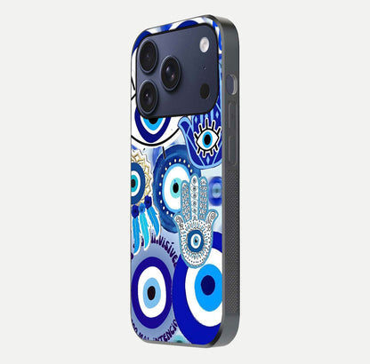 Evil Eyes Dream Glass Case for iPhone 17 Pro side-angle photo capturing smooth edges and reflective texture