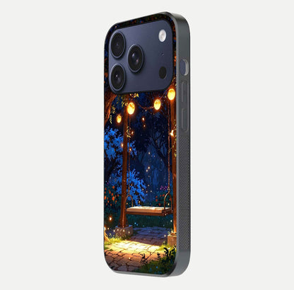 Twilight Garden Swing Glass Case for iPhone 17 Pro side-angle image showing reflection, gloss, and scenic depth