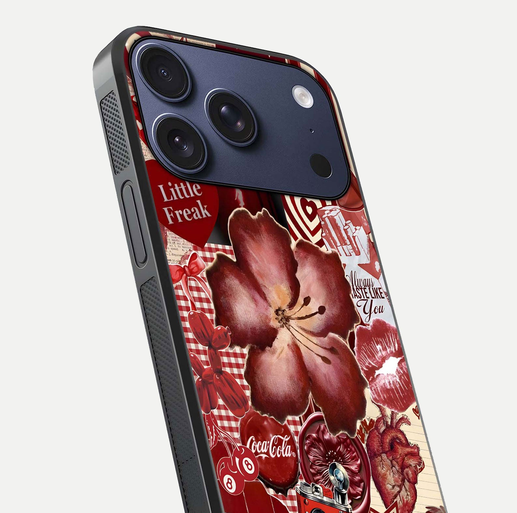Aesthetic Little Freak Glass Case for iPhone 16 Pro close-up angled shot showing detailed artwork, bold design, and gloss reflection