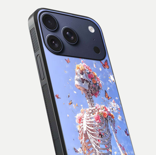 Bloom Beyond Bones Glass Case for iPhone 17 Pro close-up highlighting unique bone-floral fusion art and reflection