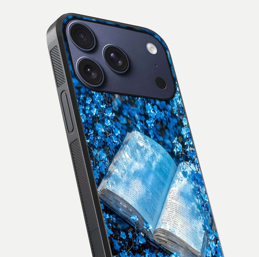 Blue Bloom Tales Glass Case for iPhone 17 Pro close-up angle showing petal texture and blue tone reflection