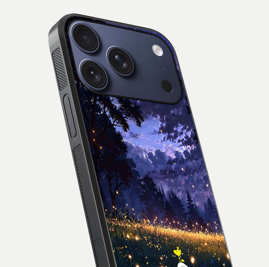 Firefly Meadow Magic Glass Case for iPhone 17 Pro close-up highlighting luminous firefly light and reflection detail