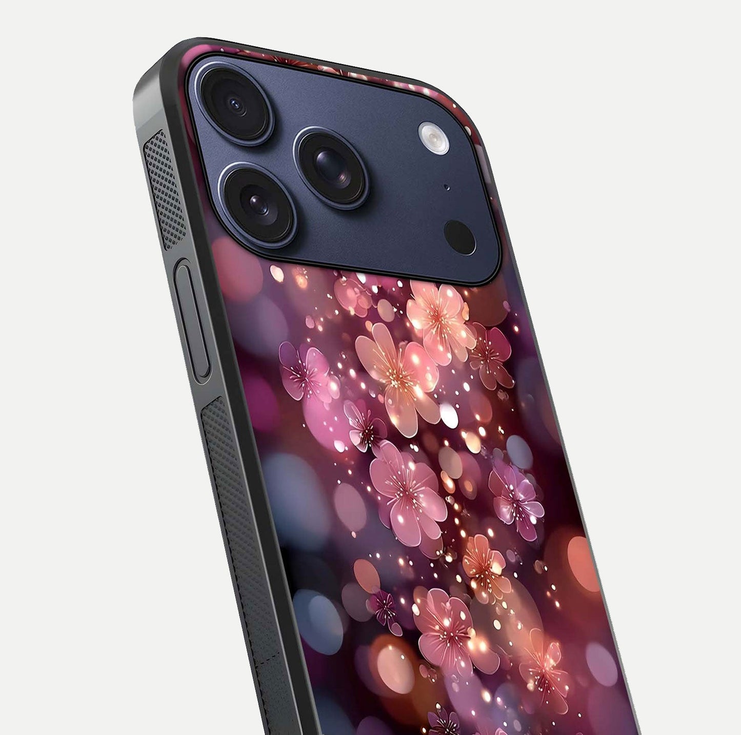 Glowing Petal Bliss Glass Case for iPhone 17 Pro close-up angled shot showing petal glow, color depth, and reflection shine