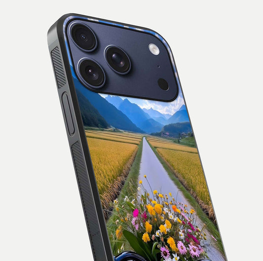Golden Field Journey Glass Case for iPhone 17 Pro close-up angled shot showing sunlight tones and reflection clarity