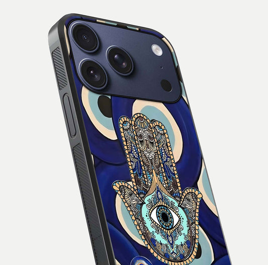 Hamsa Divine Guard Glass Case for iPhone 17 Pro close-up angled shot showing detailed palm motif and reflection glow
