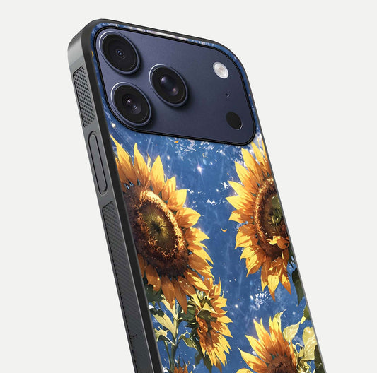 Heavenly Sunflower Rise Glass Case for iPhone 17 Pro close-up angled shot showing sunflower texture and reflection polish
