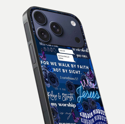 Kingdom Faith Glow Glass Case for iPhone 17 Pro close-up angled shot showing luminous text and divine reflection