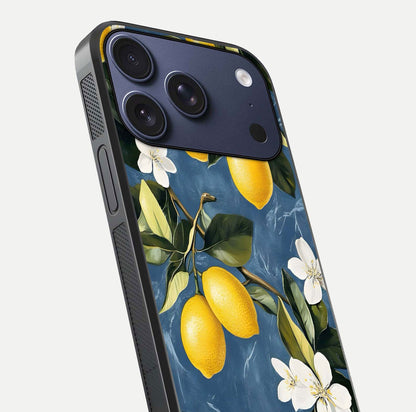 Lemon Dream Garden Glass Case for iPhone 17 Pro close-up angled shot showing fruit details and shine reflection