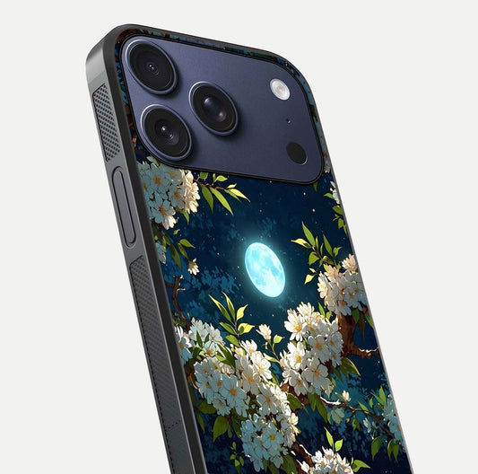 Moonlit Blossom Dream Glass Case for iPhone 17 Pro close-up angled shot showing glowing petals and reflection