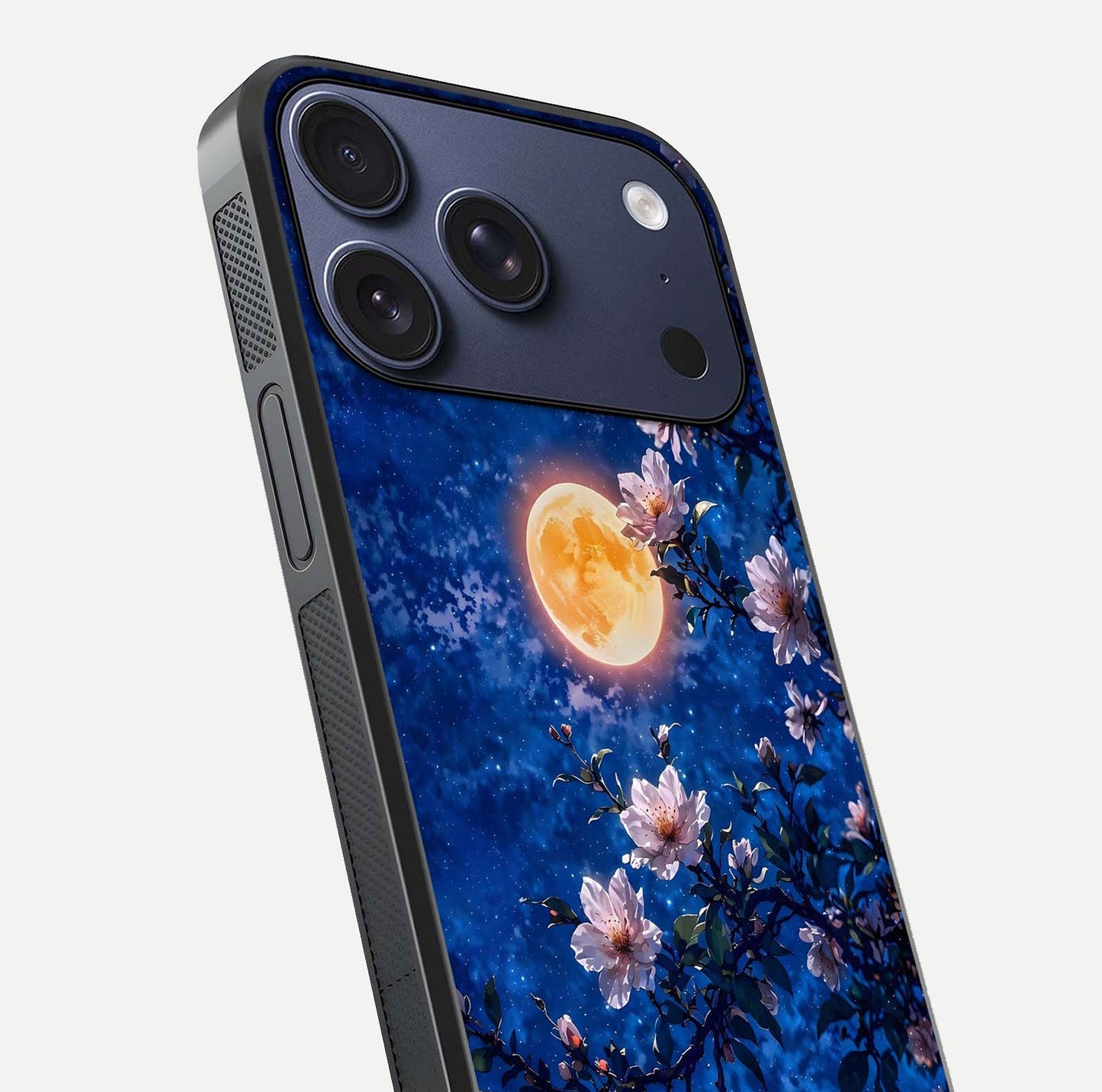 Moonlit Blossoms Night Glass Case for iPhone 17 Pro close-up angled shot showing petal glow and reflection detail