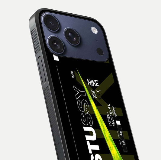 Neon Street Edition Glass Case for iPhone 17 Pro close-up angled shot showing urban neon lights and shine