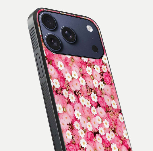 Pink Daisy Bliss Glass Case for iPhone 17 Pro close-up angled shot highlighting daisy detail and reflection glow