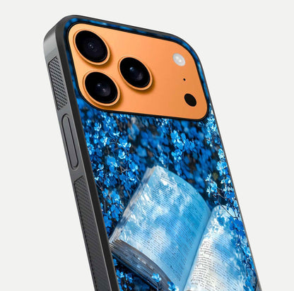 Blue Bloom Tales Glass Case for iPhone 17 Pro Max close-up angle showing petal texture and blue tone reflection